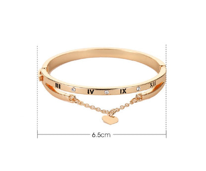 Rose gold-tone bangle bracelet with roman numerals, heart charm, 6.5cm width