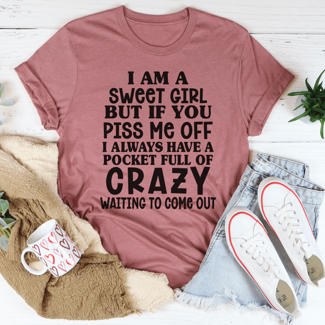 Dusty rose graphic T-shirt with bold slogan text centered on the chest