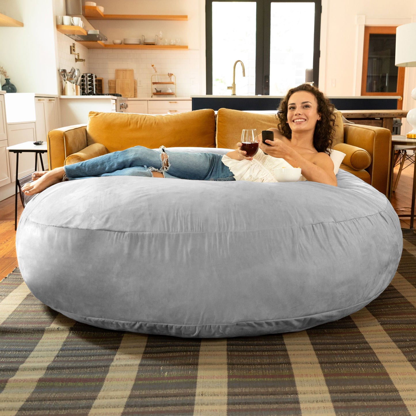 Large bean bag chair in gray, rounded cocoon shape with soft microsuede cover