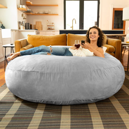 Large bean bag chair in gray, rounded cocoon shape with soft microsuede cover