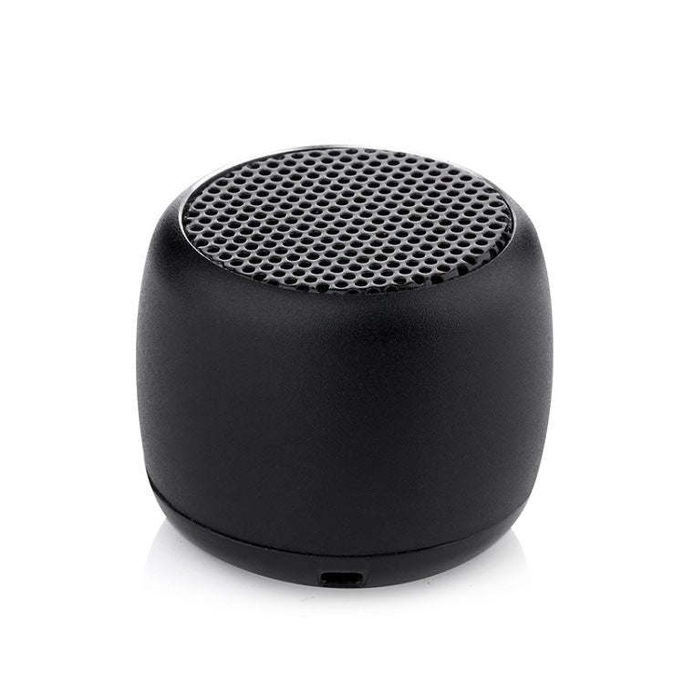 Black cylindrical mini Bluetooth speaker with top speaker grille and bottom port