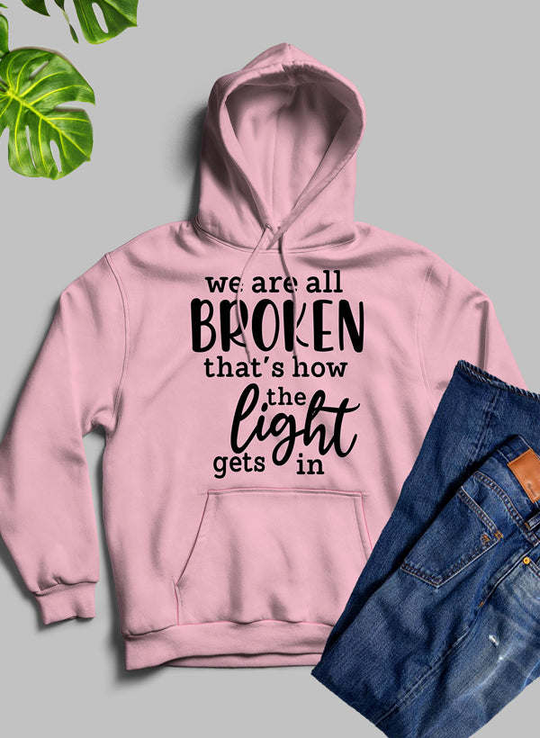Dusty pink pullover hoodie with drawstring hood, front 'BROKEN' graphic, and kangaroo pocket