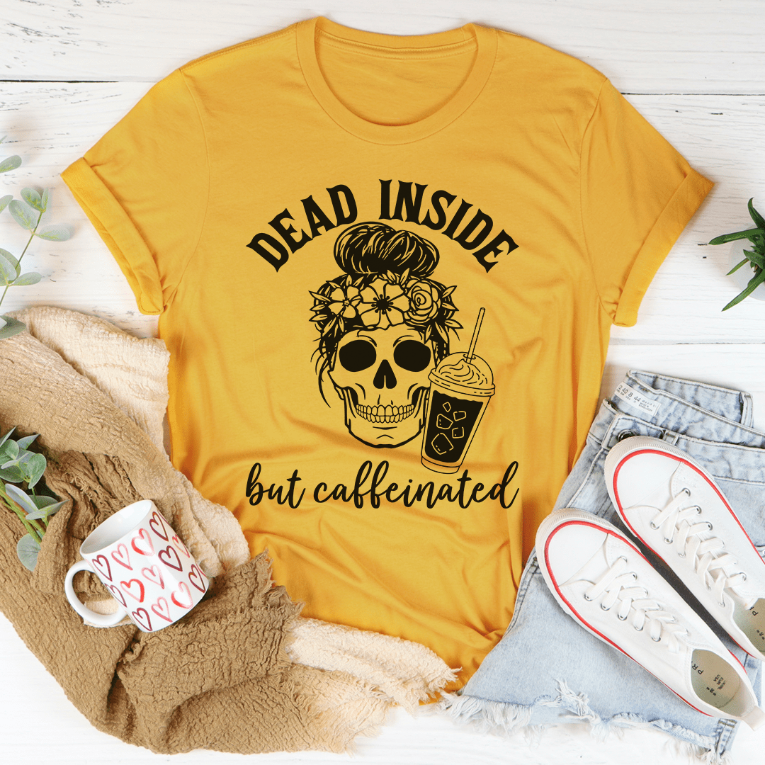 Mustard yellow crewneck t-shirt with skull graphic and 'but caffeinated' text