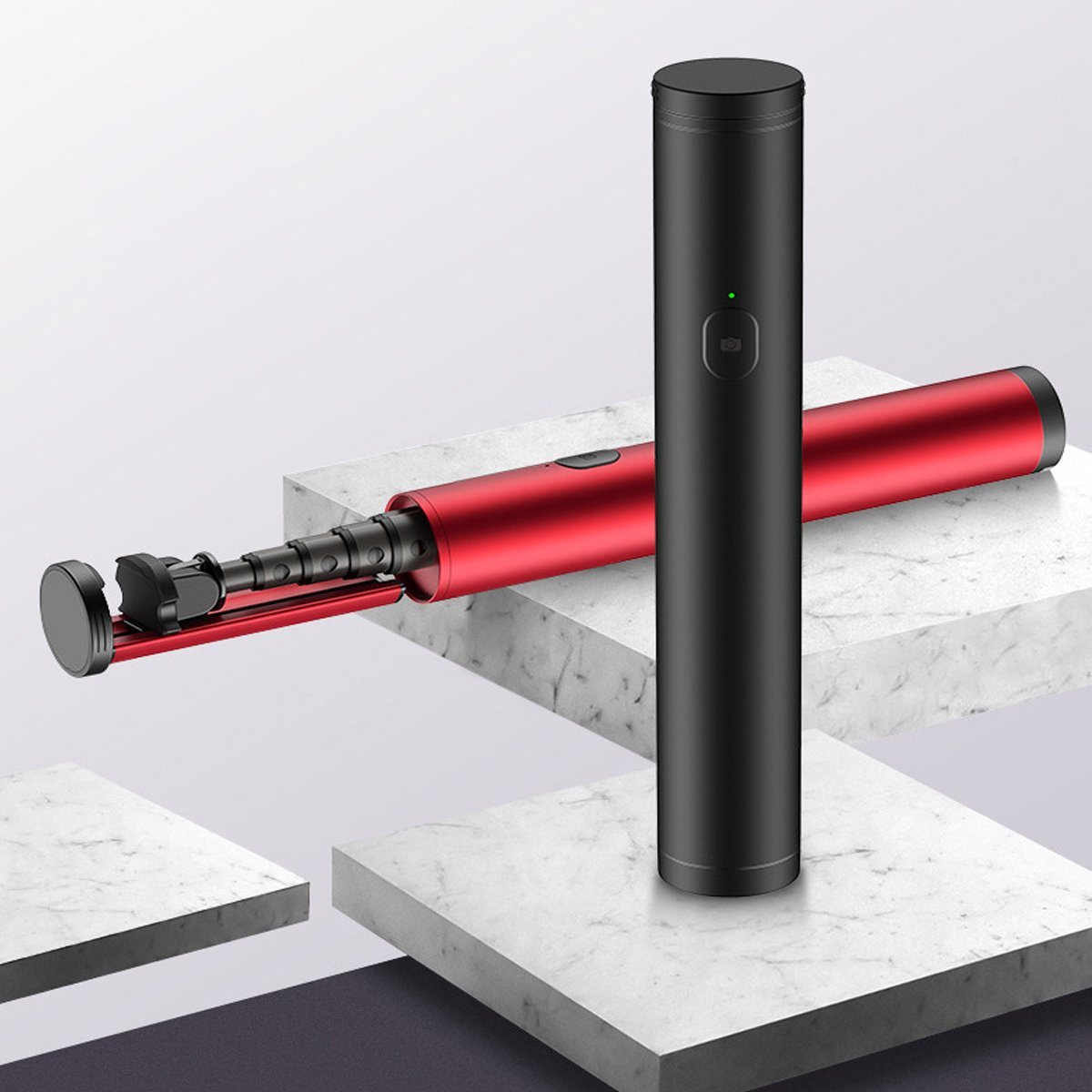 Black mini selfie stick with red extendable arm and phone mount, standing upright.
