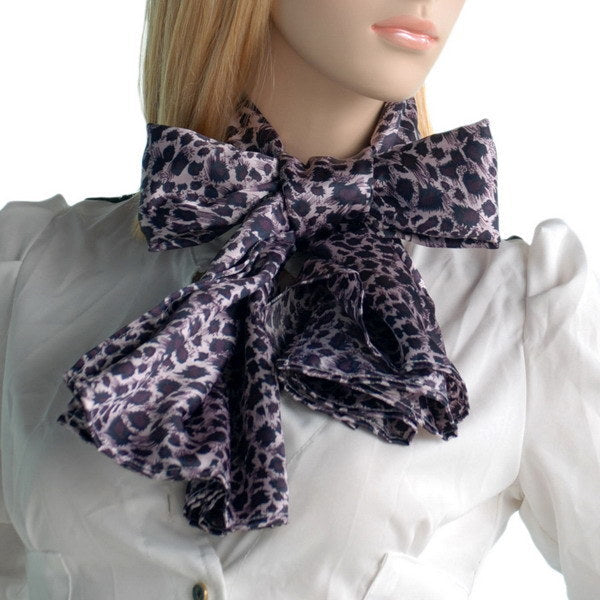Leopard print silk scarf with knot and short drape at collar