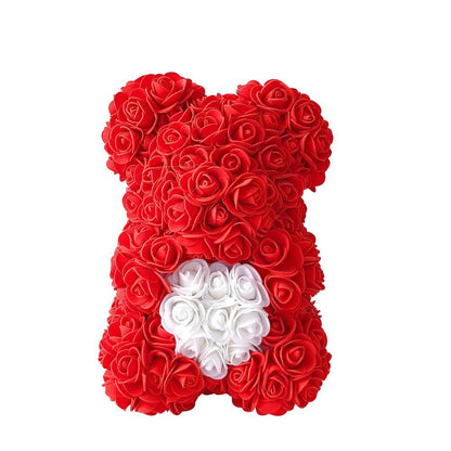 Red rose teddy bear with white rosette heart on the belly and black bow