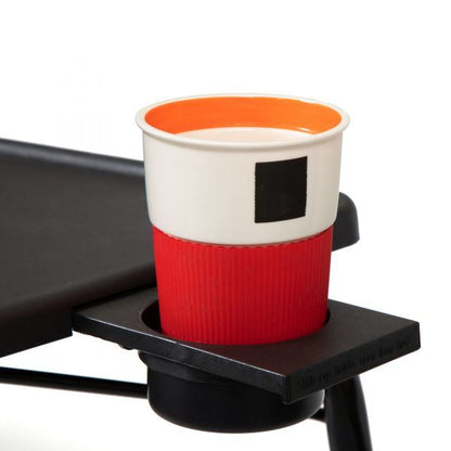 Black TV tray table with cup holder holding a red drink cup