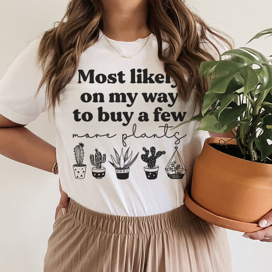 White crewneck graphic t-shirt with cactus icons and 'Most likely on my way to buy'