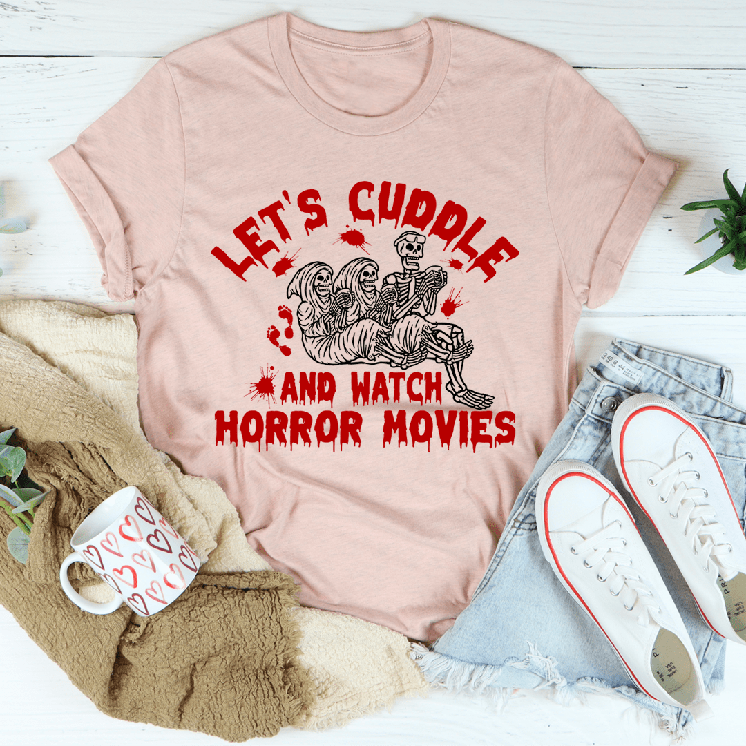 Pink crew-neck T-shirt with large red front graphic of skeletons and horror movie lettering