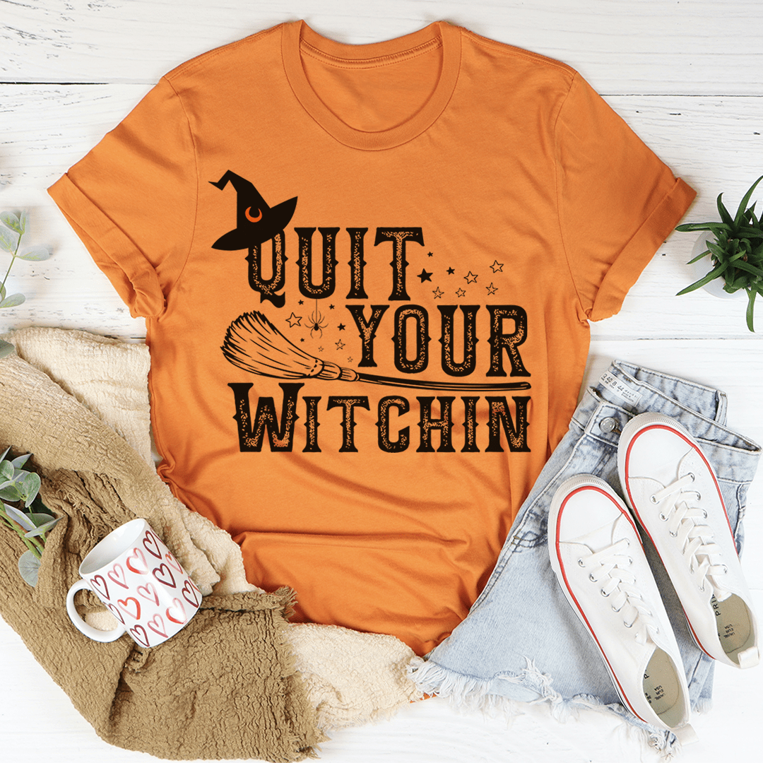 Orange t-shirt with black witch cat and “Quit Your Witchin” graphic