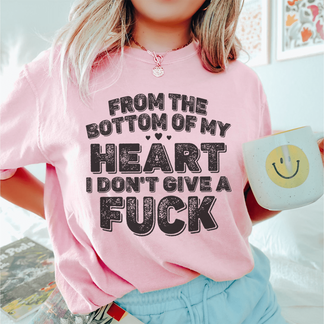 Pink T-shirt with bold heart slogan graphic in black and white