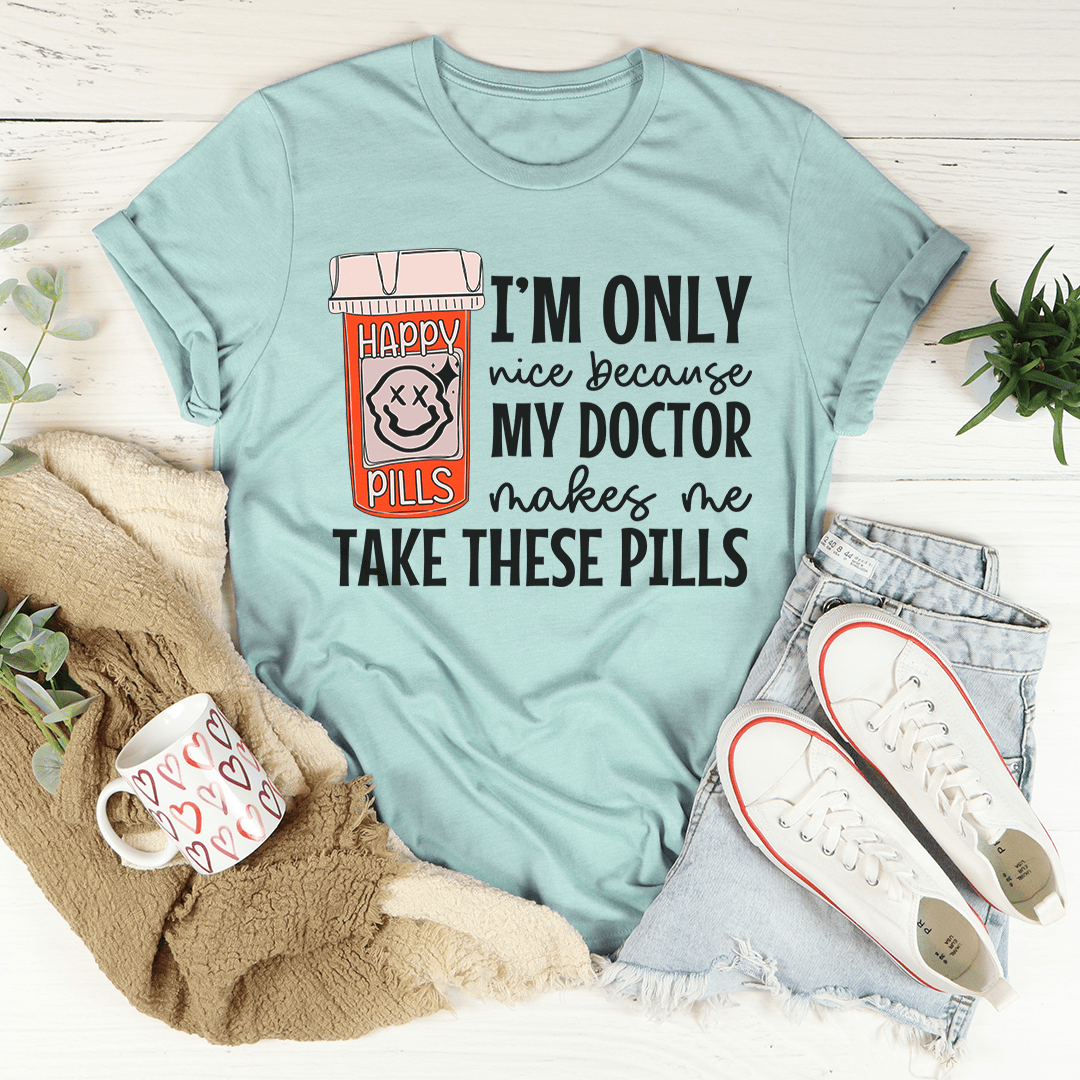 Teal Happy Pills graphic T-shirt with pill-themed “I’m only nice because my doctor” slogan