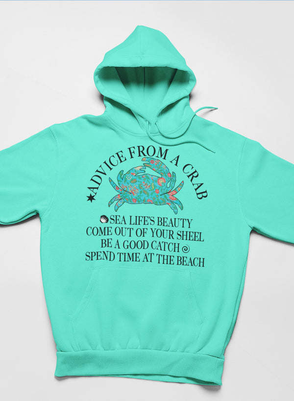 Mint green hooded sweatshirt with crab artwork and quote text centered on front
