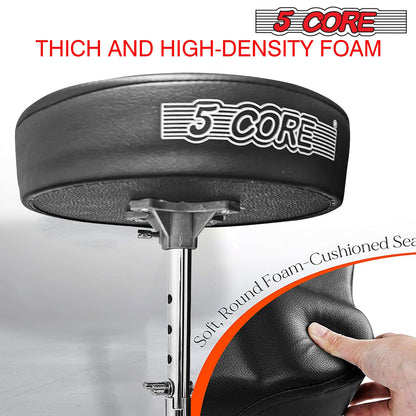 Black padded round drum stool seat on chrome center post, textured foam detail.