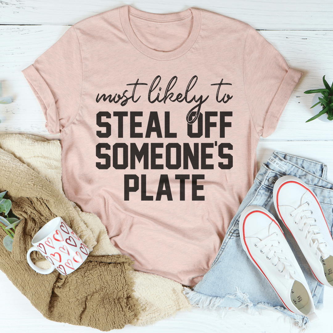 Peach crew-neck T-shirt with large “most likely to steal off someone's plate” text.