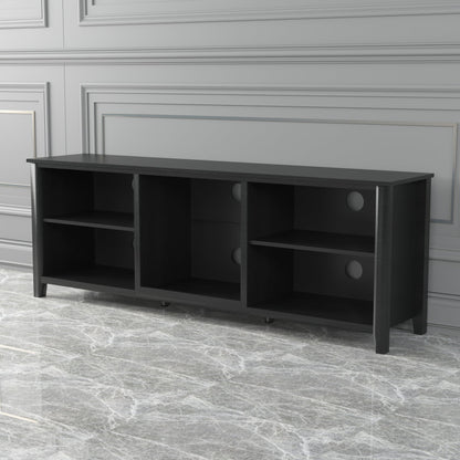 Black TV stand storage console with multiple open compartments and round pull drawers.