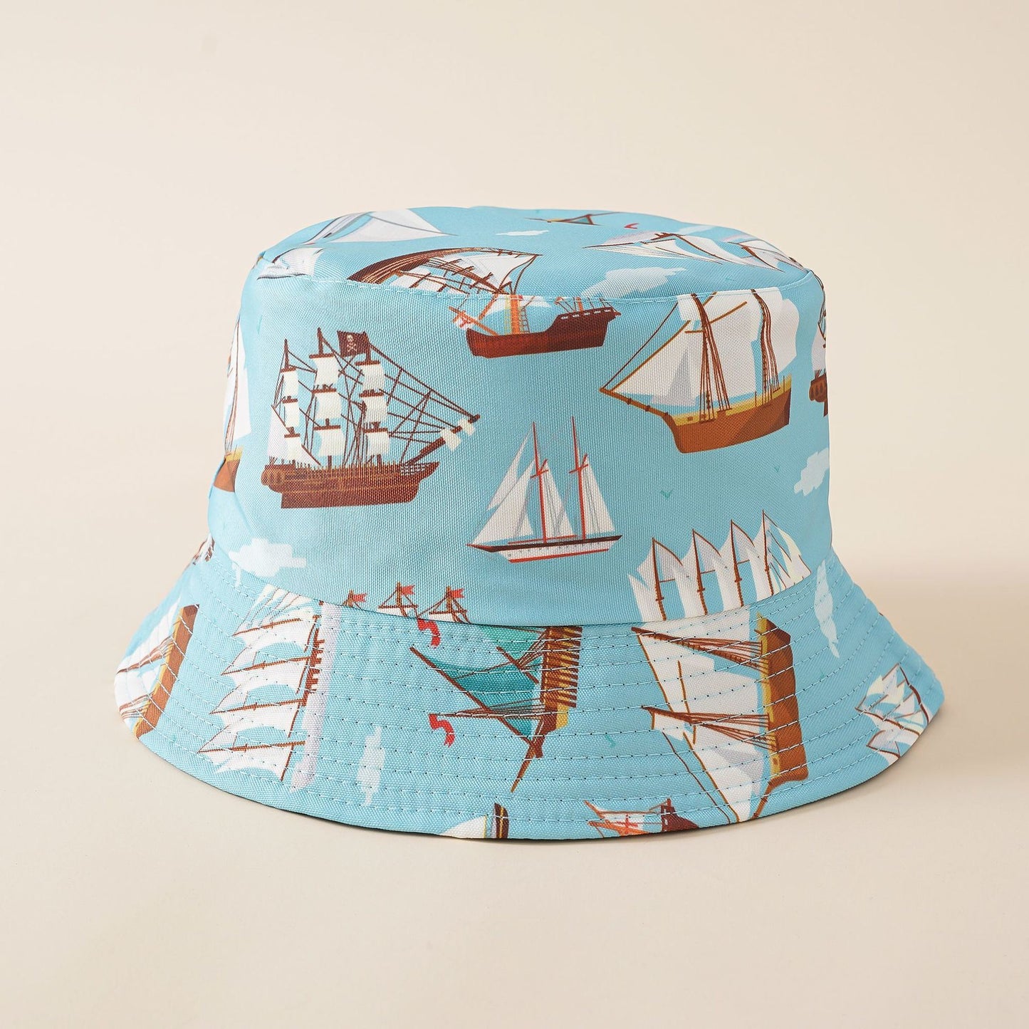 Light blue fisherman bucket hat with sailing ships and sailboat pattern, wide brim