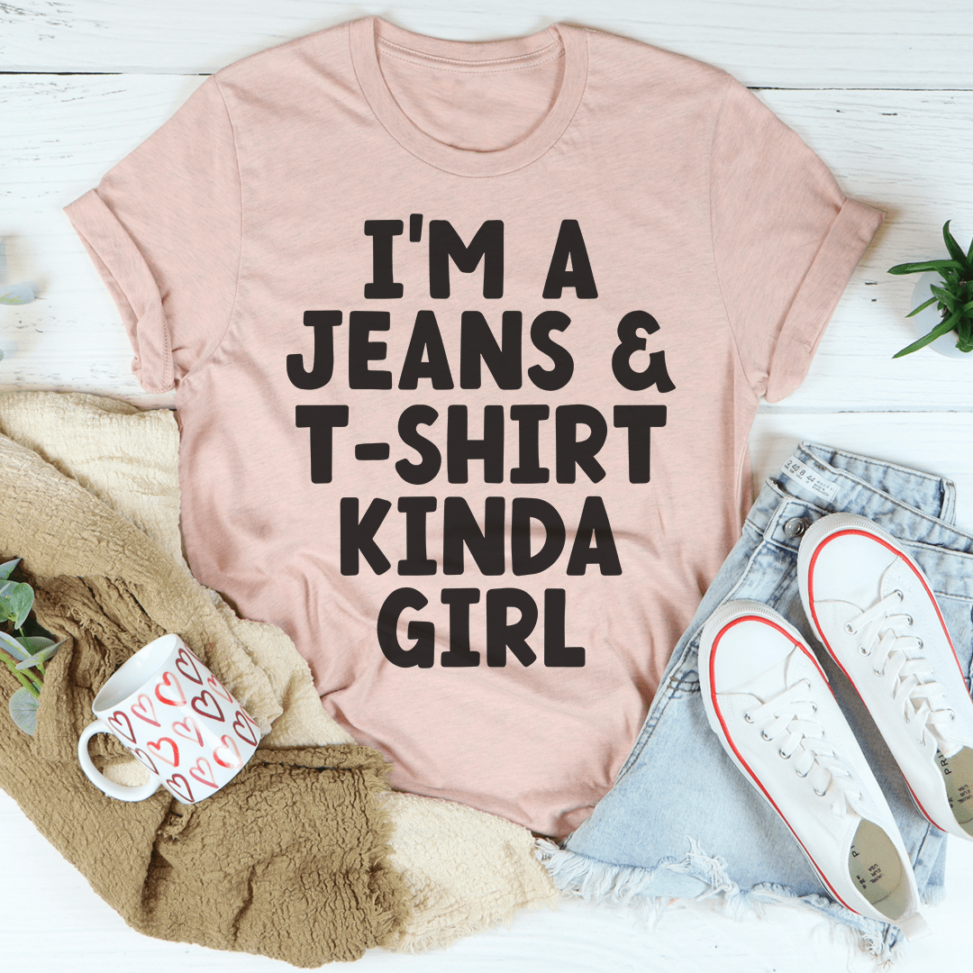 Pink graphic T-shirt with bold black typographic slogan, crew neck, short sleeves.