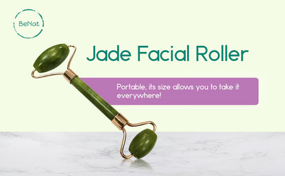 Jade facial roller with two green end stones on a gold-toned handle