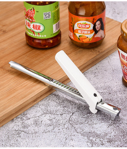 Jar lid opener with white handle and serrated stainless grip for tightening lids on jars.