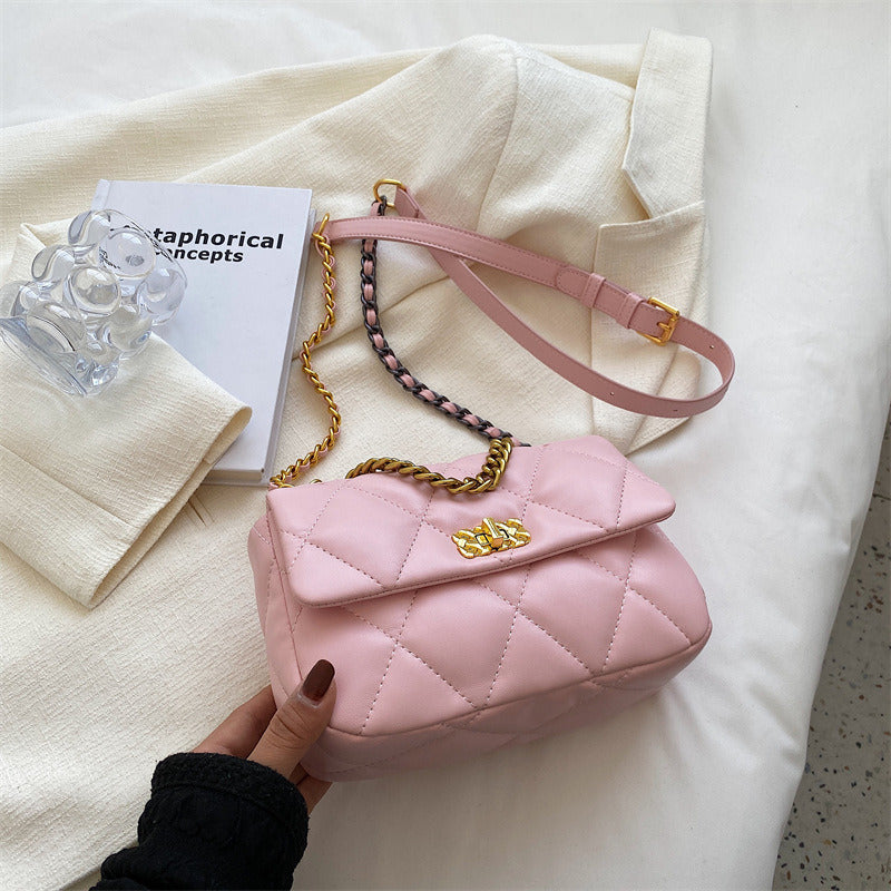Pink diamond-quilted mini shoulder bag with gold buckle and chain strap