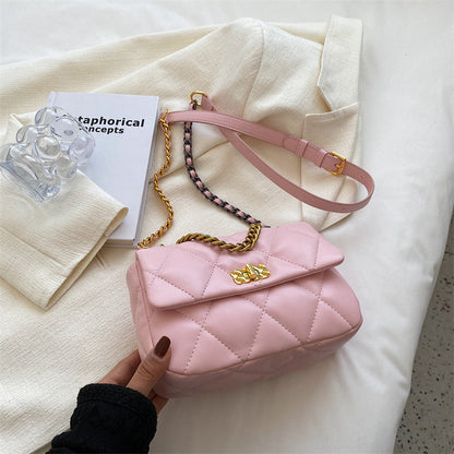 Pink diamond-quilted mini shoulder bag with gold buckle and chain strap
