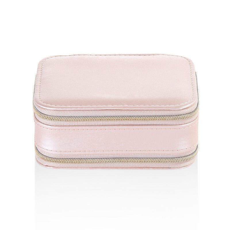 Pink small jewelry case with dual zipper openings and smooth PU leather finish
