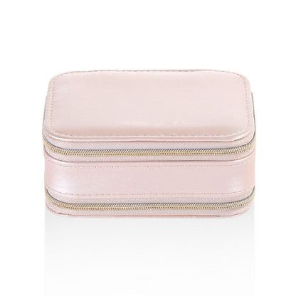 Pink small jewelry case with dual zipper openings and smooth PU leather finish