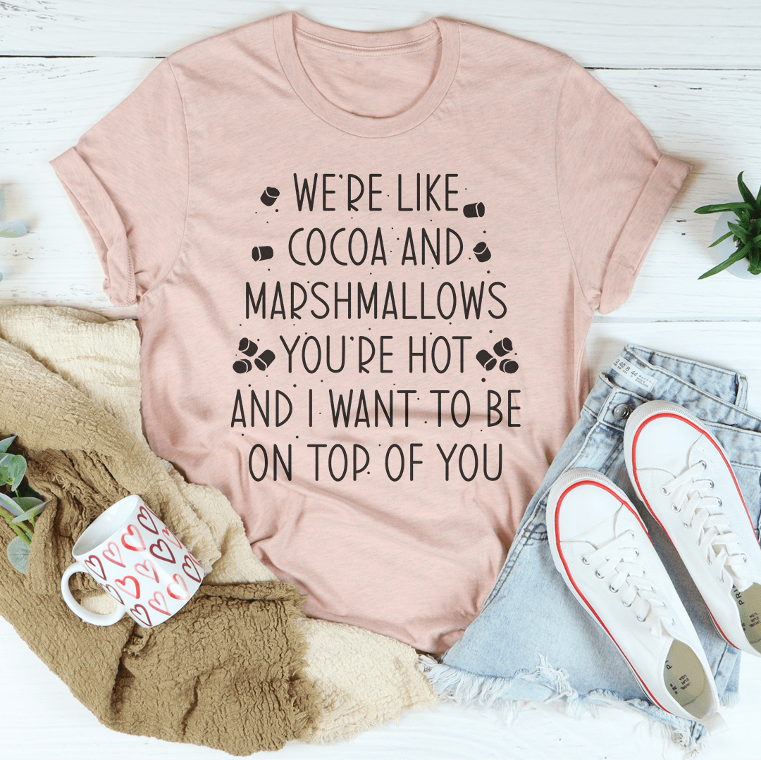 Light pink T-shirt with "We're Like Cocoa and Marshmallows" graphic text