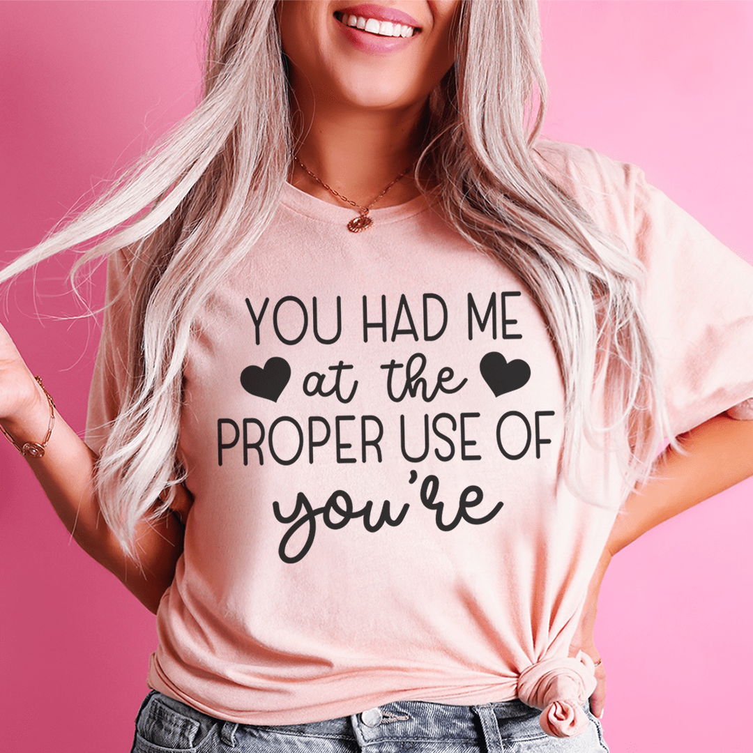 Mauve crew-neck short-sleeve T-shirt with heart graphic slogan text in dark ink