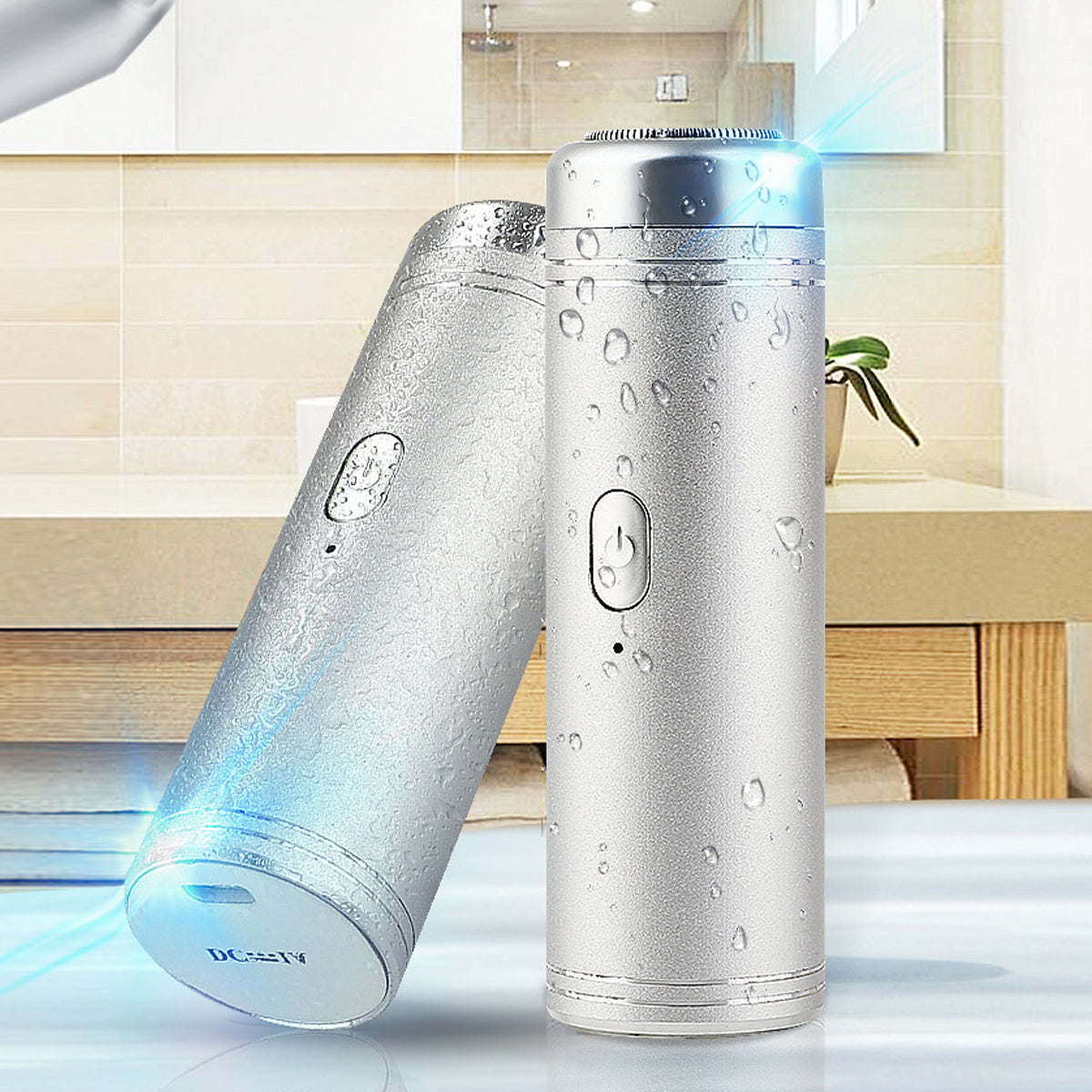 Silver USB electric shaver with water droplets and glowing blue light on head