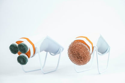 Single head attachment with orange bristle scrubber head on white stand