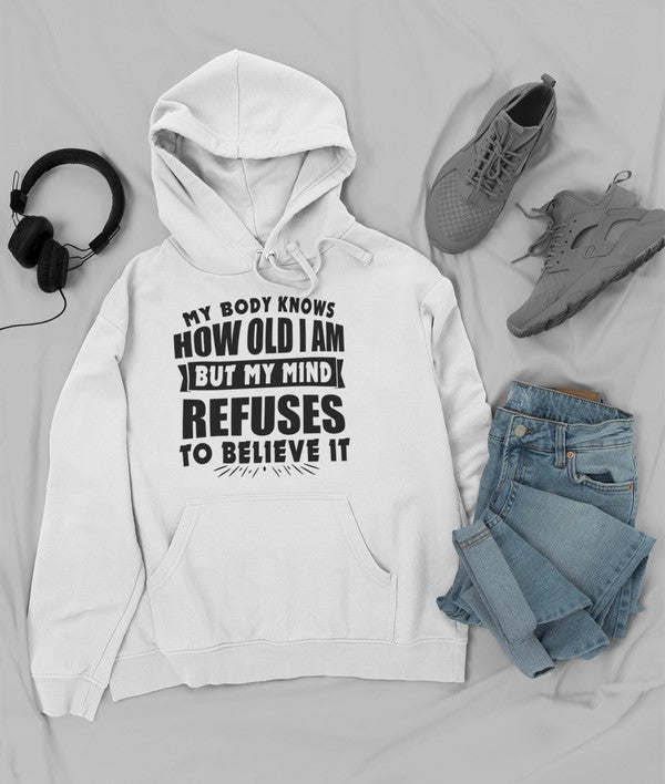 White pullover hoodie with kangaroo pocket, drawstring, and bold front quote graphic.