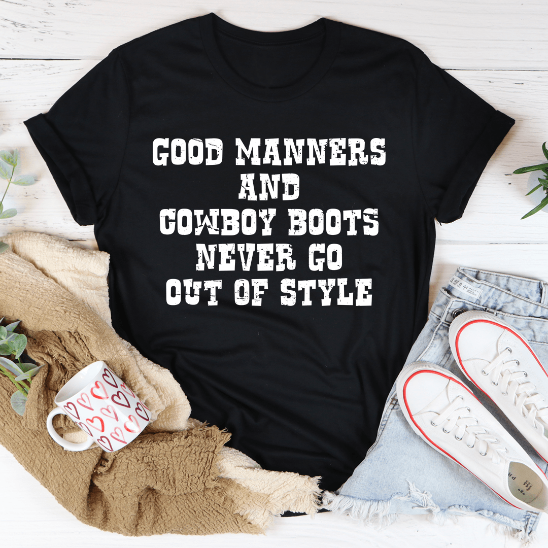 Black crewneck T-shirt with bold centered “Good Manners and Cowboy Boots” print