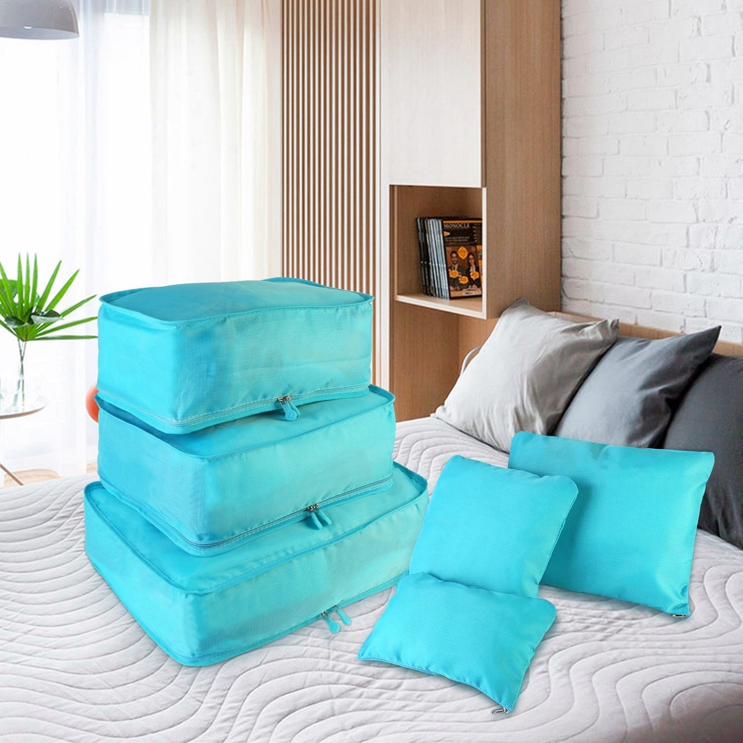 Turquoise packing cubes with zip closures and matching storage pillows set