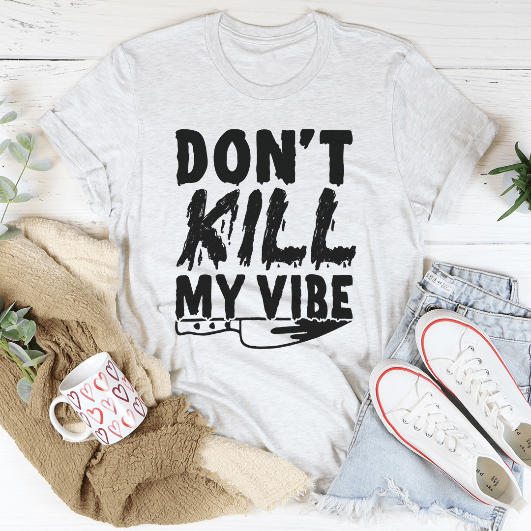 Light gray short-sleeve T-shirt with black “DON’T KILL MY VIBE” graphic