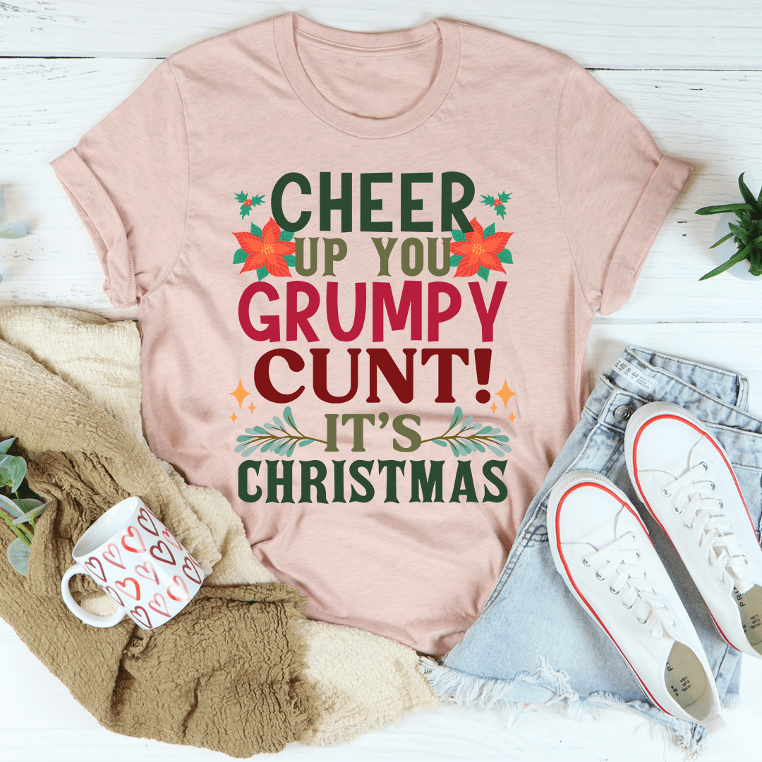 Pink Christmas t-shirt with colorful 'CHEER UP YOU GRUMPY CUNT!' and 'IT'S CHRISTMAS' text
