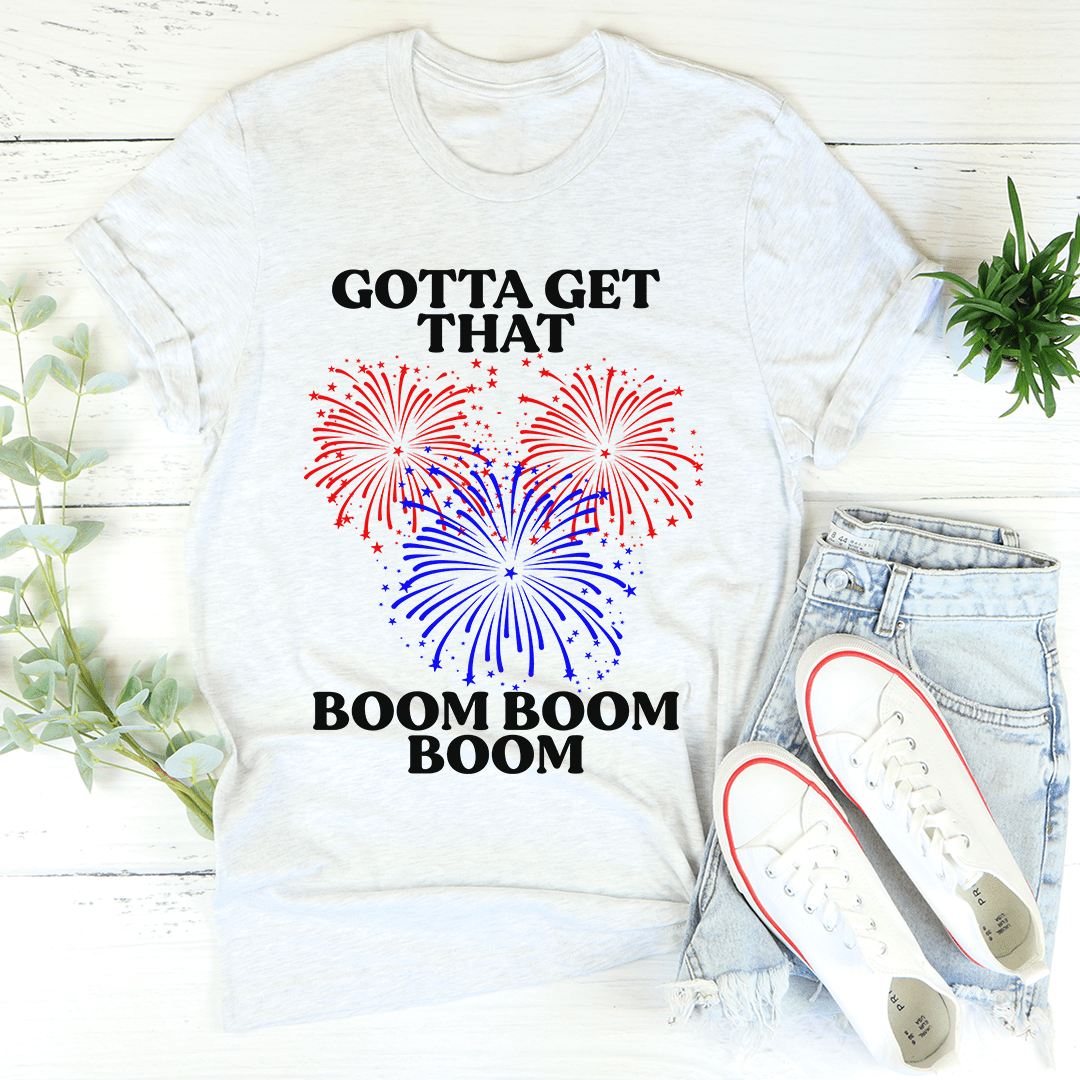 Light gray crewneck T-shirt with fireworks graphic, 'GOTTA GET THAT' and 'BOOM BOOM BOOM'