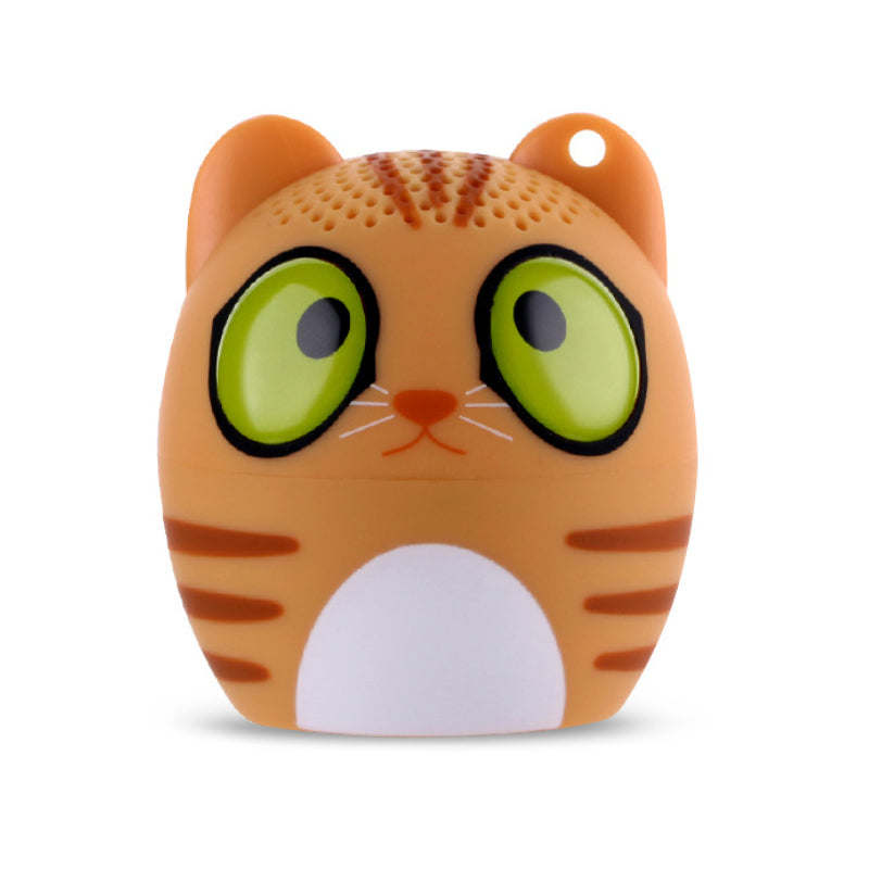 Orange tiger-shaped Bluetooth speaker with green eyes and a white belly patch