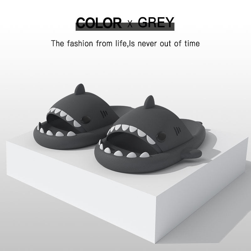 Dark gray shark-shape EVA slide sandals, open toe with ridged sole, pair view.