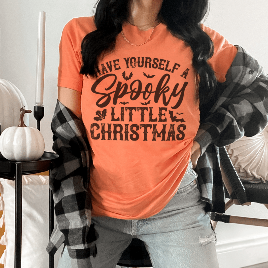 Orange Halloween-style Christmas T-shirt with 'Spooky Little Christmas' typography front graphic