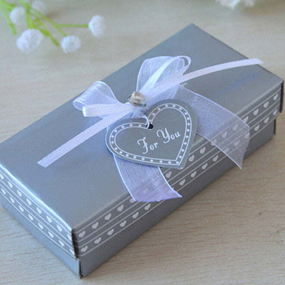 Wine gift box with blue ribbon and heart tag reading “For You”