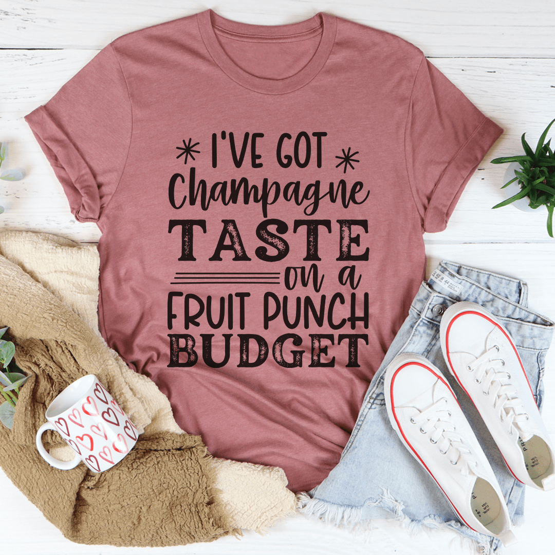 Mauve T-shirt with front slogan: "I've got Champagne Taste on a Fruit Punch Budget"