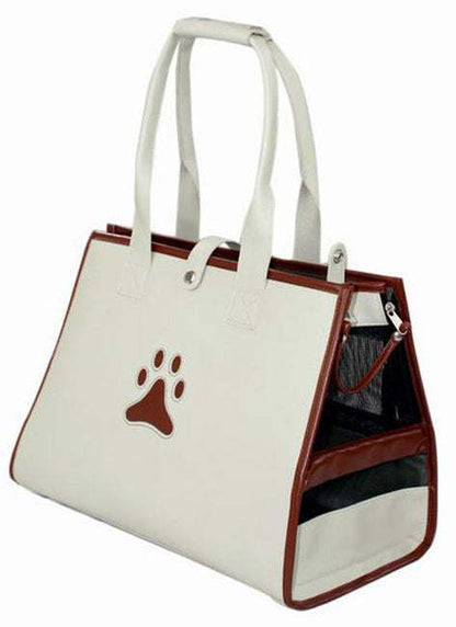 Cream pet carrier tote with brown handles, paw logo, and front mesh window.