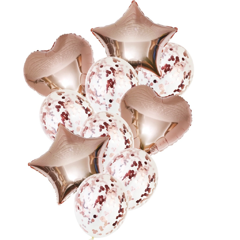 Assorted heart and round foil balloons in rose gold and white with red confetti