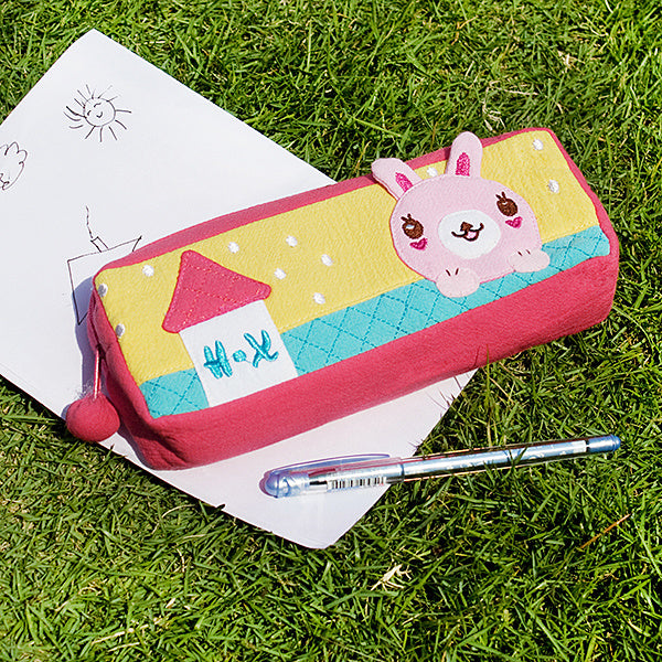 Embroidered pencil pouch with rabbit face applique, red pink trim, yellow and teal stripes