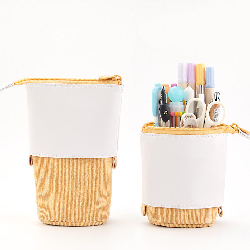 Set of telescopic stationery cases with zipper, white top and tan corduroy bottom, pens inside