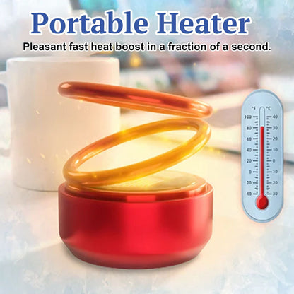 Red portable heater with glowing double ring beside a mug