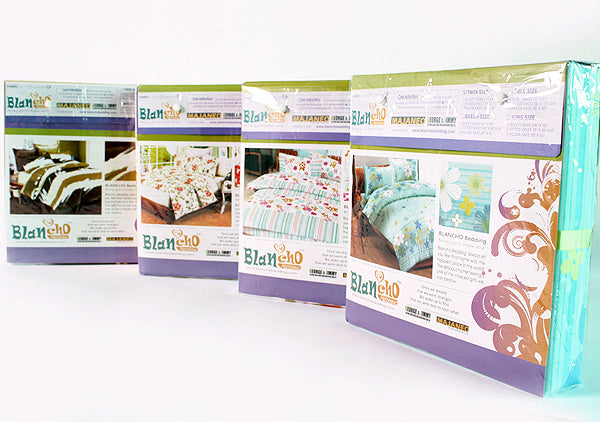 Assorted mini comforter set boxes with leaf and floral printed bedding designs