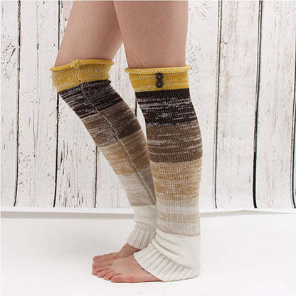 Knee-high striped socks with white toe, yellow cuff, and gray-brown color pattern.